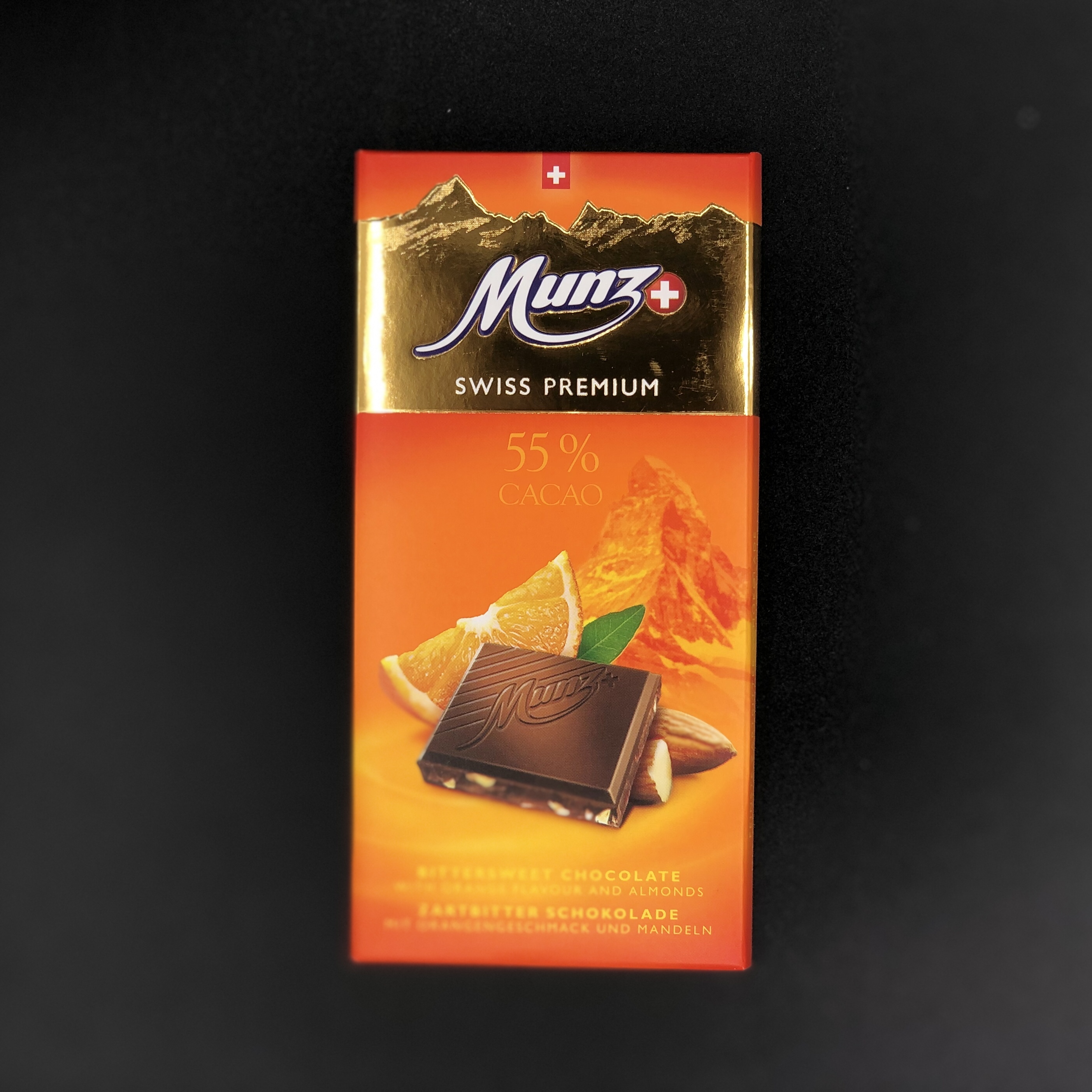 Горький шоколад Munz с апельсином и миндалем 100г